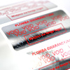 z_usl_nad_p 45x18 mm plomby gwarancyjne VOID SREBRNE nadruk CZERWONY 100 szt.