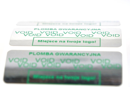 z_usl_nad_p 45x18 mm plomby gwarancyjne VOID SREBRNE nadruk ZIELONY 100 szt.
