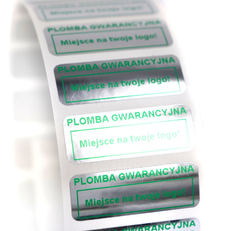 z_usl_nad_p 30x11 mm plomby gwarancyjne VOID SREBRNE nadruk ZIELONY 100 szt.